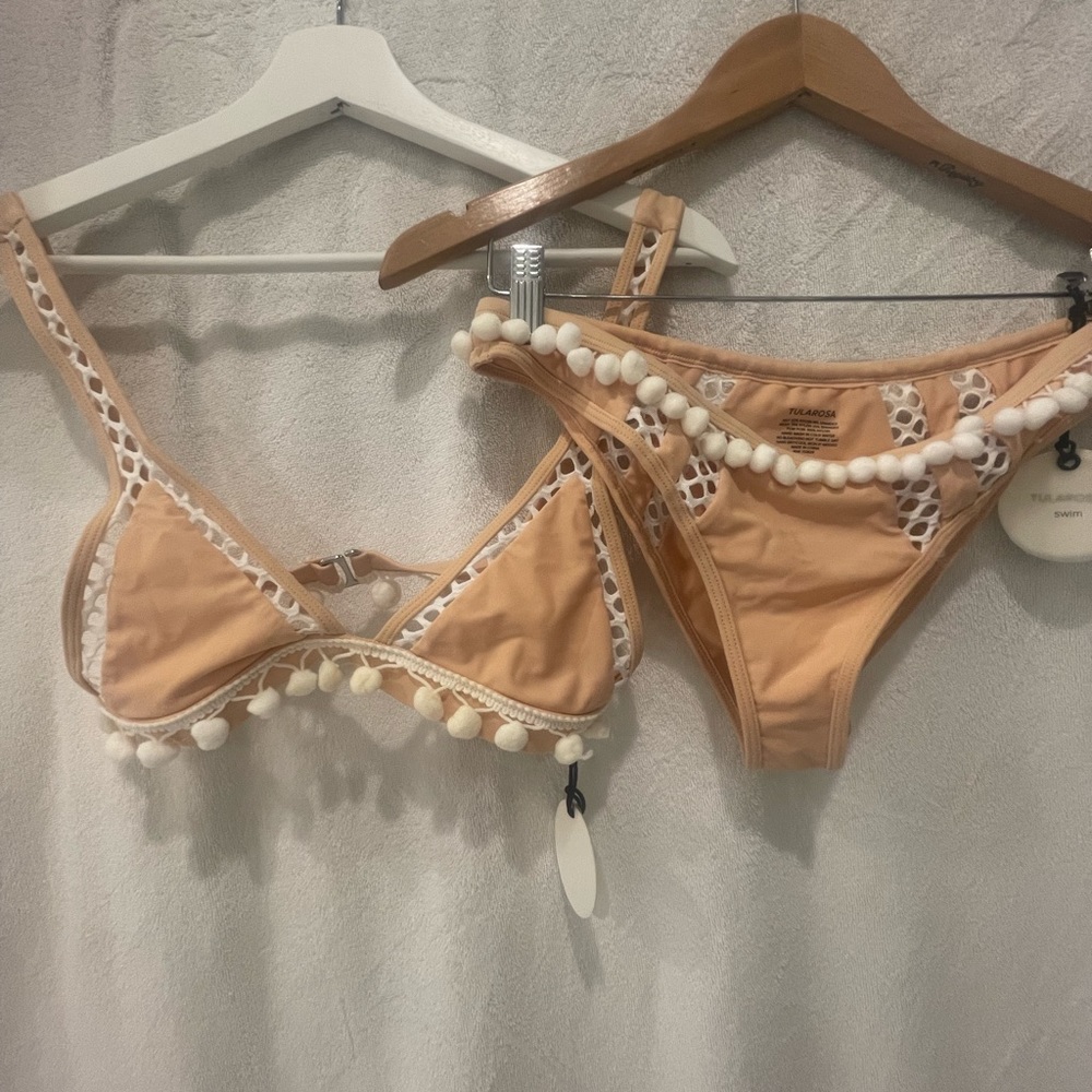 Tularosa swim suit, brand new with tags. Small top, medium bottoms.
